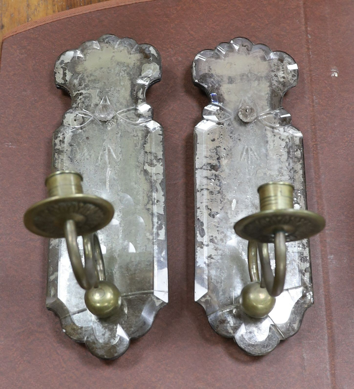 A pair of 18th century style single sconce girandoles, with foiled backs, length 31cm